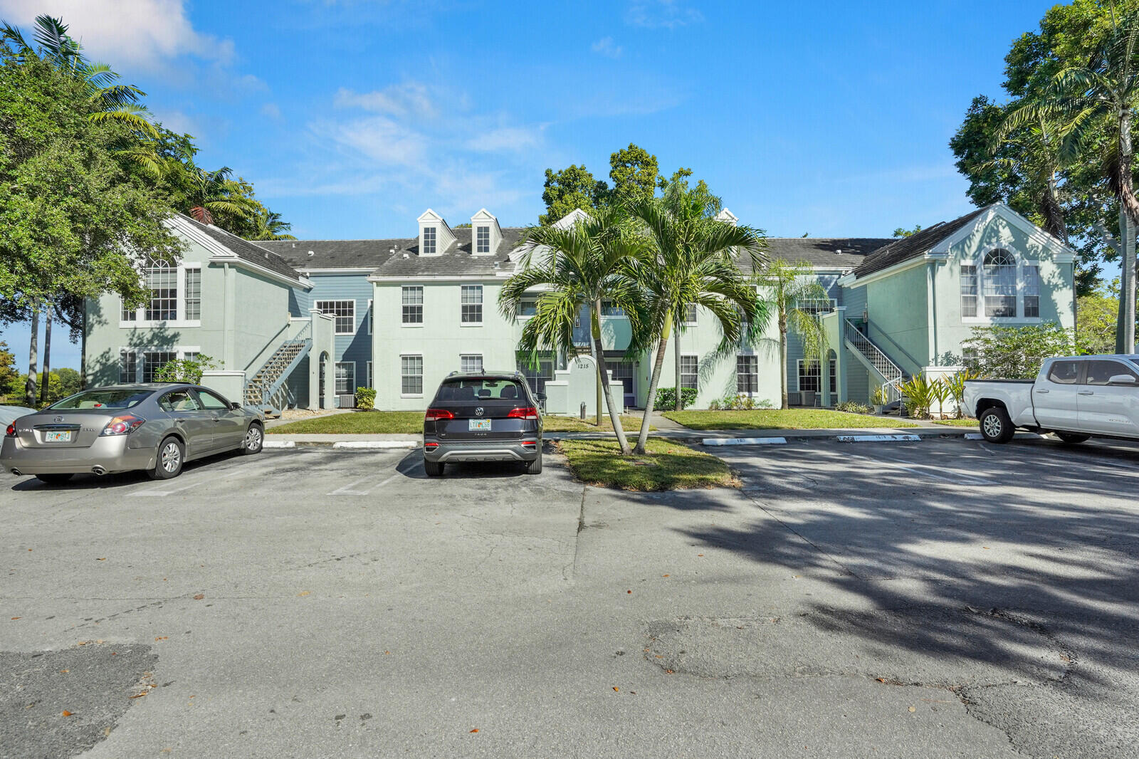 1215 Crystal Way, Unit N Delray Beach, FL 33444 - Photo 2 of 29 a view of a street with cars