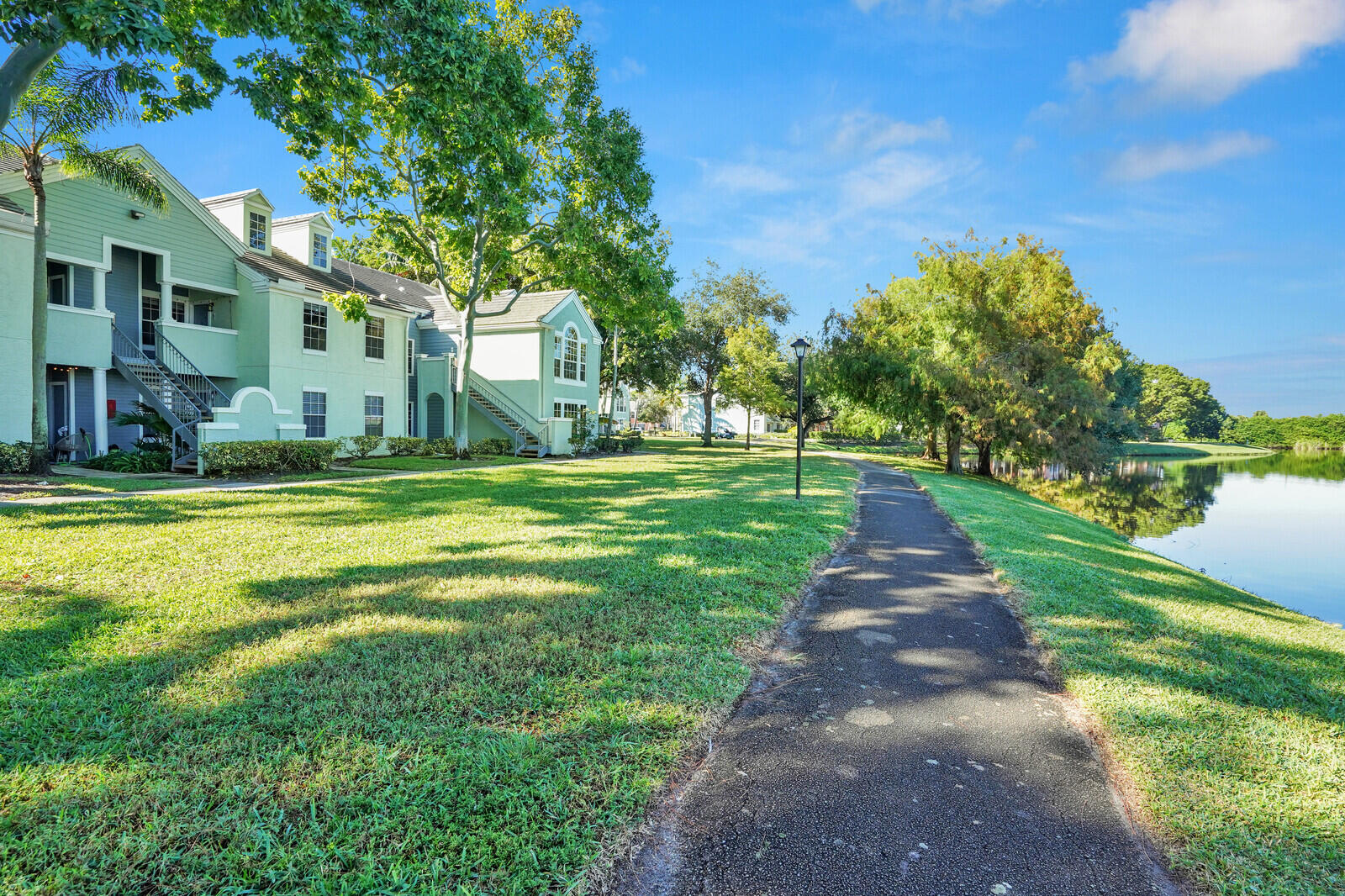 1215 Crystal Way, Unit N Delray Beach, FL 33444 - Photo 25 of 29 a view of a park with large trees