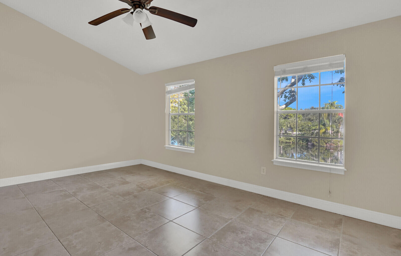 1215 Crystal Way, Unit N Delray Beach, FL 33444 - Photo 3 of 29 a view of an empty room with a window