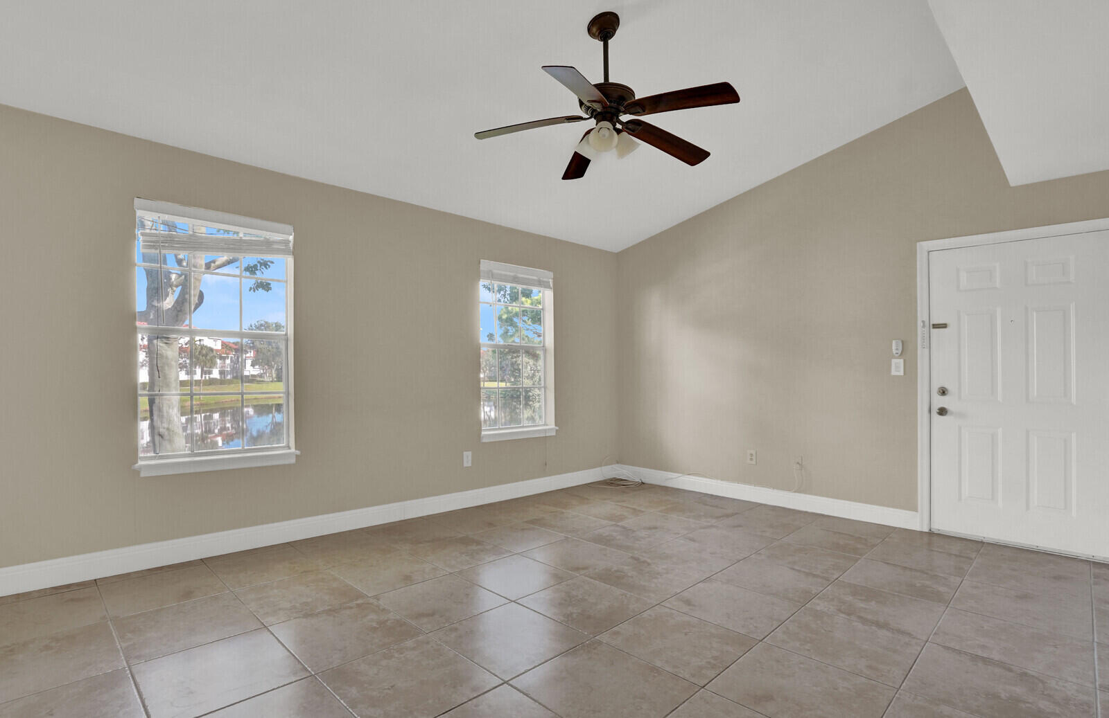 1215 Crystal Way, Unit N Delray Beach, FL 33444 - Photo 5 of 29 a view of room with a ceiling fan and window