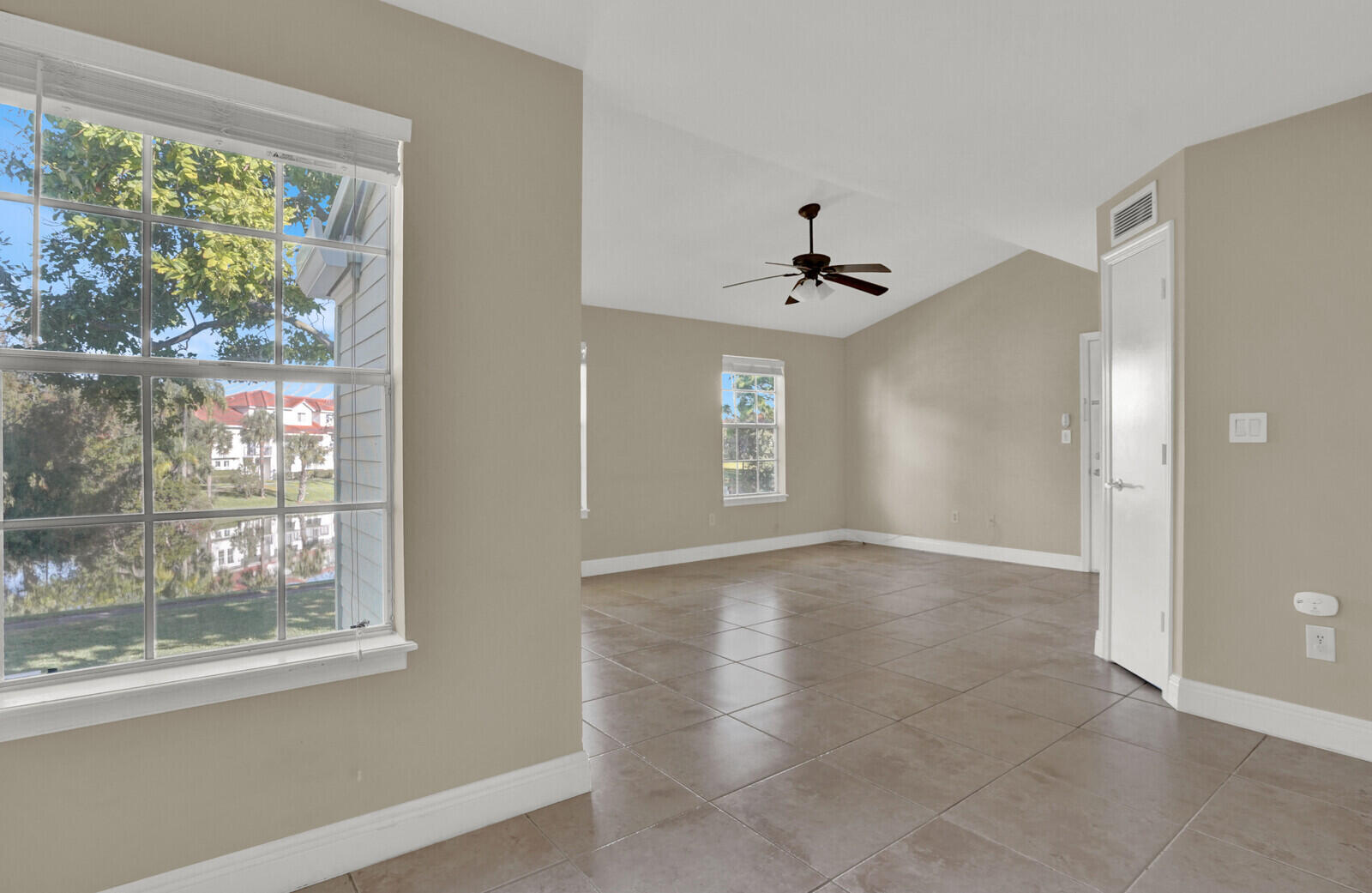 1215 Crystal Way, Unit N Delray Beach, FL 33444 - Photo 9 of 29 a view of an empty room with a window