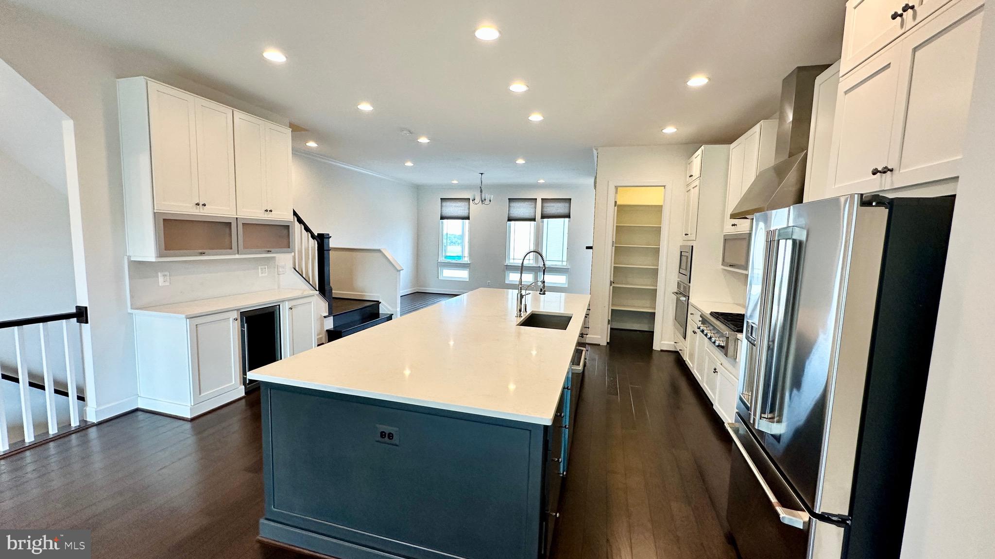 20265 Oak Bluff Drive Ashburn, VA 20147 - Photo 14 of 42 a kitchen with stainless steel appliances a refrigerator and a stove