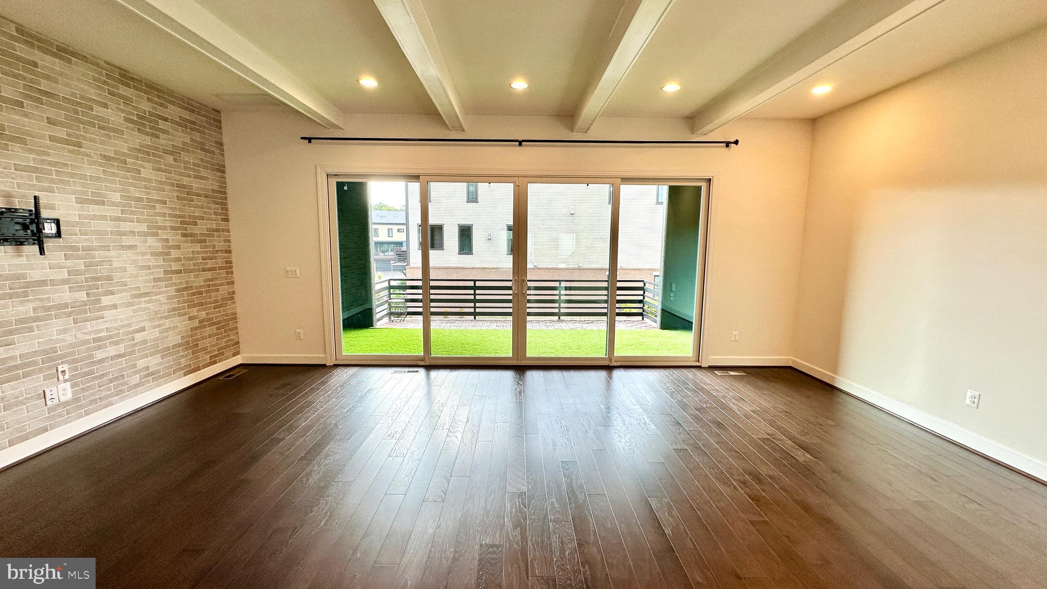 20265 Oak Bluff Drive Ashburn, VA 20147 - Photo 18 of 42 an empty room with wooden floor and walls