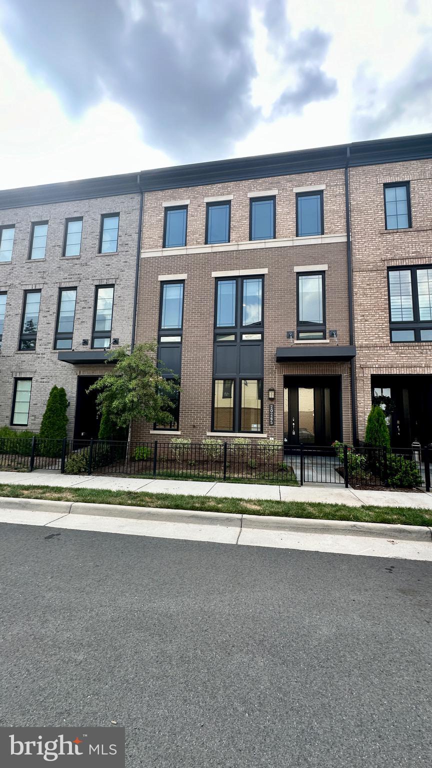 20265 Oak Bluff Drive Ashburn, VA 20147 - Photo 2 of 42 a house view with a garden space