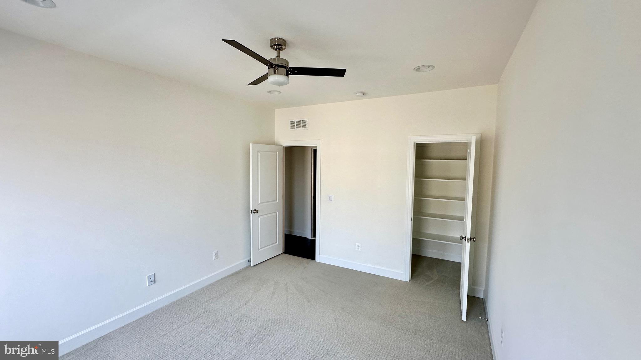 20265 Oak Bluff Drive Ashburn, VA 20147 - Photo 33 of 42 a view of empty room with closet and ceiling fan