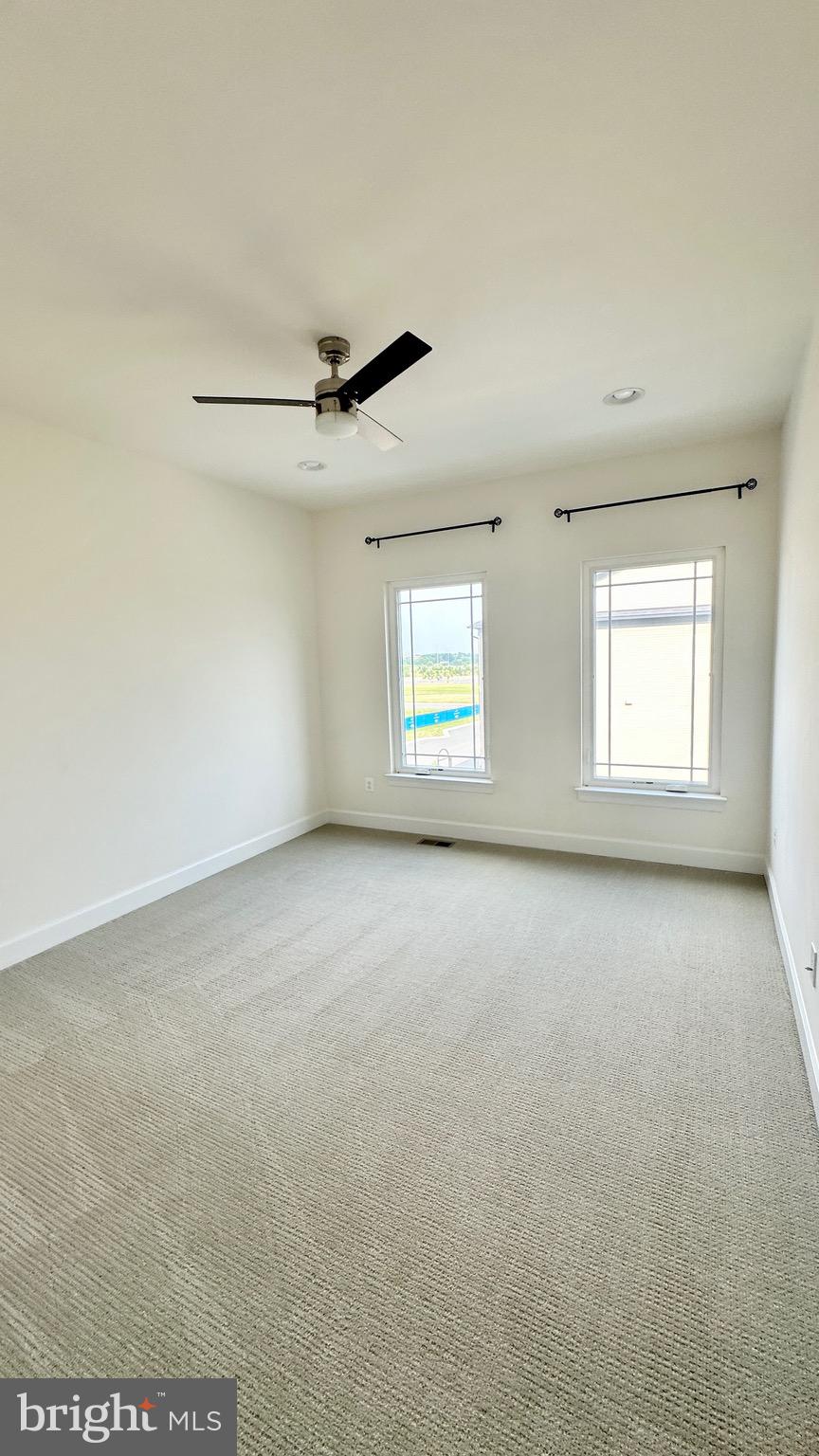 20265 Oak Bluff Drive Ashburn, VA 20147 - Photo 34 of 42 an empty room with a empty space and windows