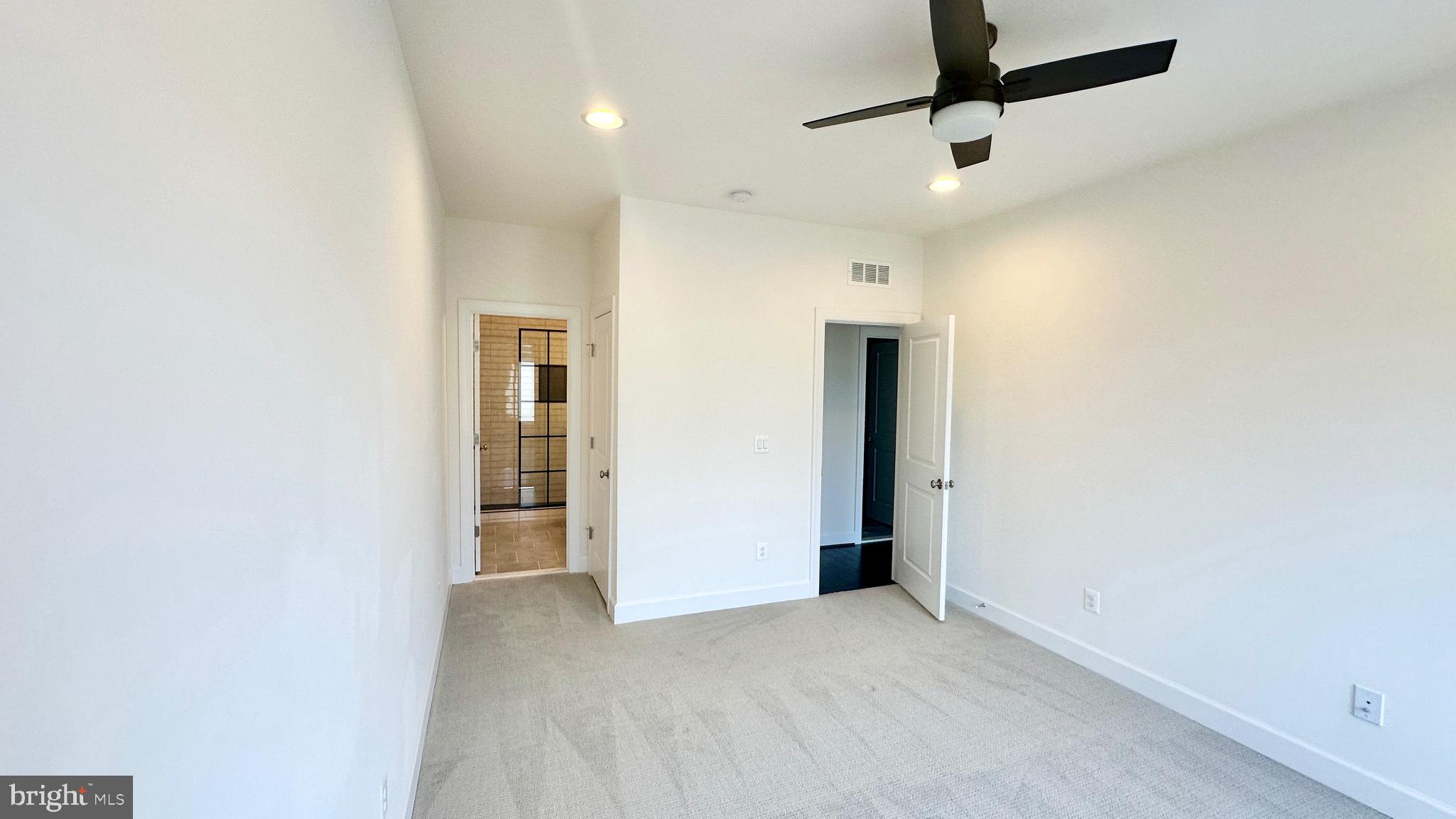 20265 Oak Bluff Drive Ashburn, VA 20147 - Photo 38 of 42 an empty room with closet and a ceiling fan