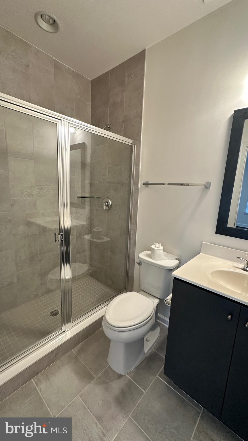 20265 Oak Bluff Drive Ashburn, VA 20147 - Photo 40 of 42 a bathroom with a toilet and a shower