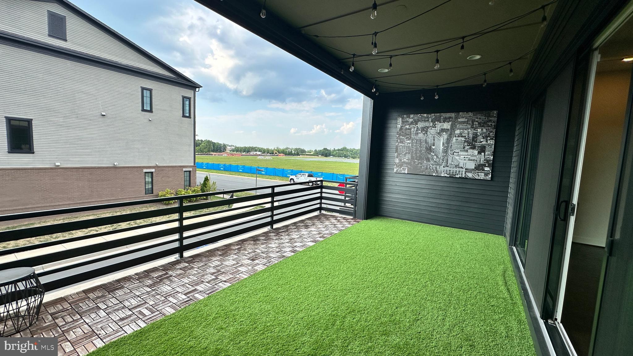 20265 Oak Bluff Drive Ashburn, VA 20147 - Photo 42 of 42 a view of a porch with furniture and a yard