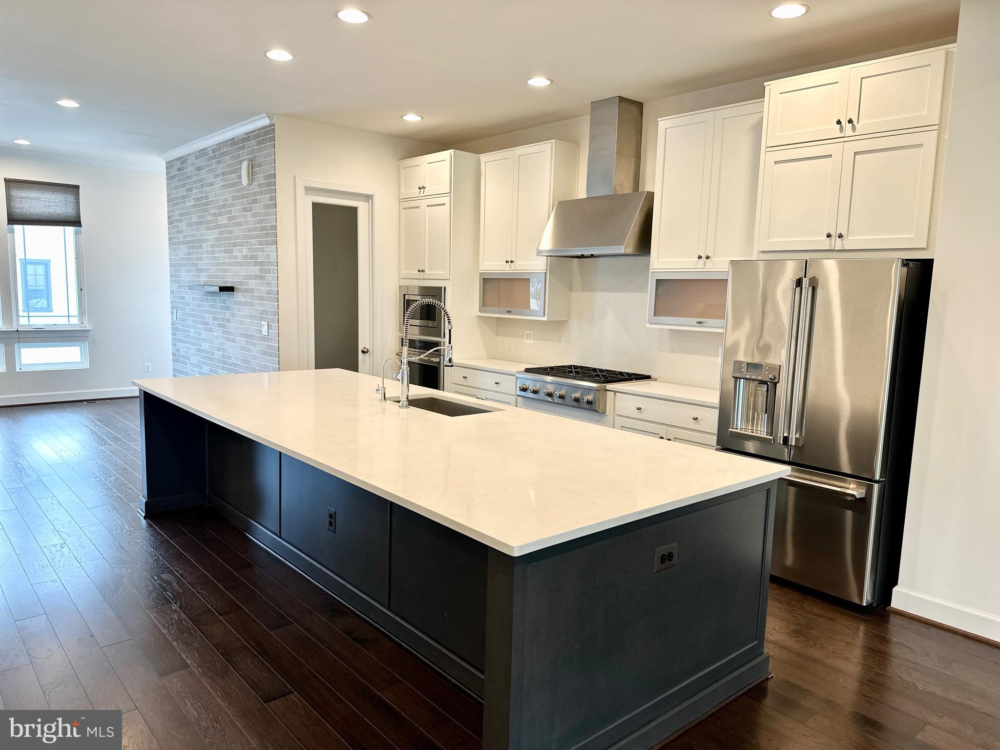 20265 Oak Bluff Drive Ashburn, VA 20147 - Photo 10 of 42 a kitchen with stainless steel appliances a refrigerator and a stove