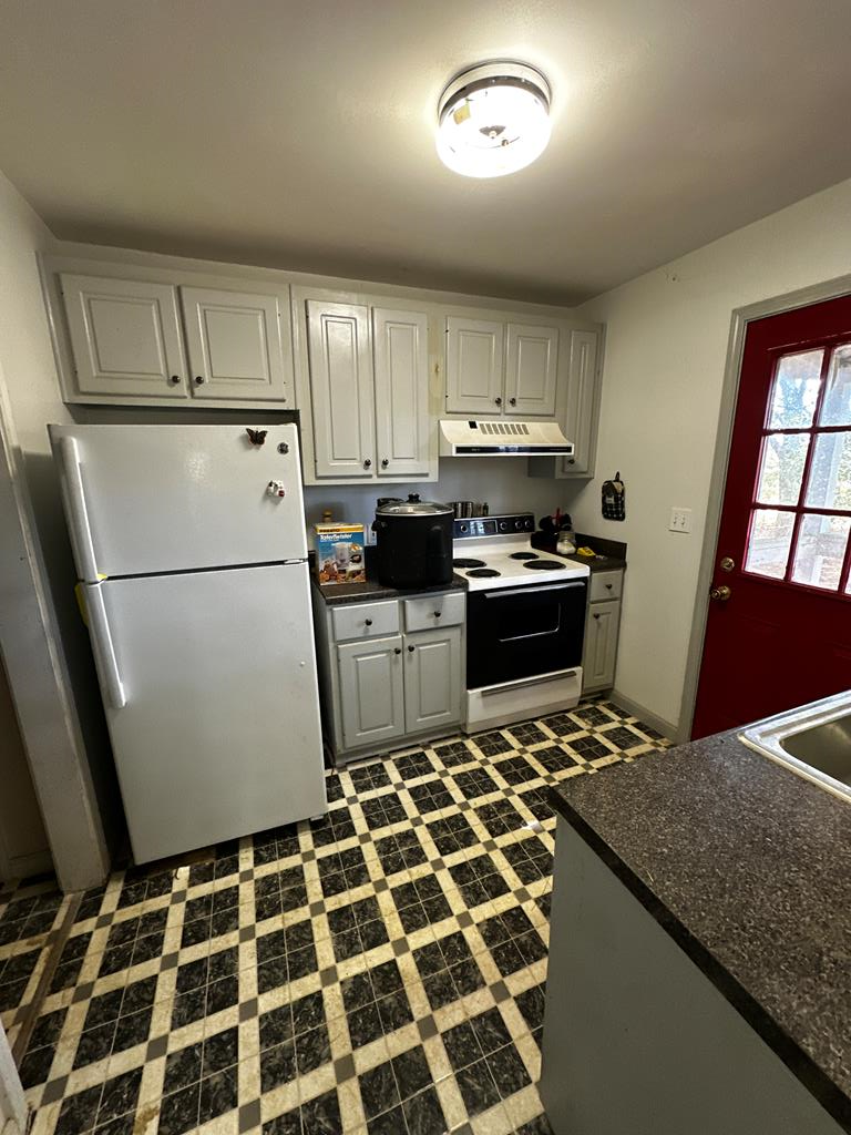 1966 Highway 142 Covington, GA 30014 - Photo 14 of 96 a kitchen with granite countertop appliances a sink and a cabinets
