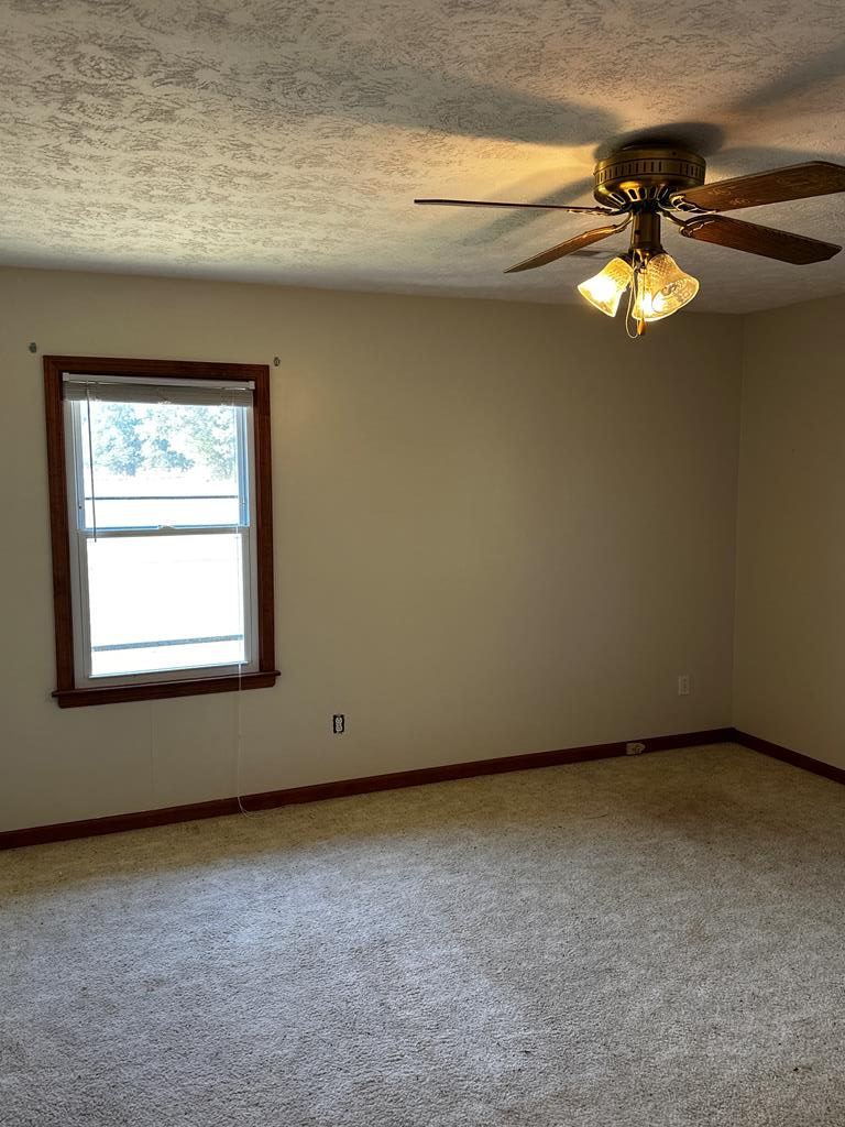 1966 Highway 142 Covington, GA 30014 - Photo 2 of 96 a view of an empty room with a window