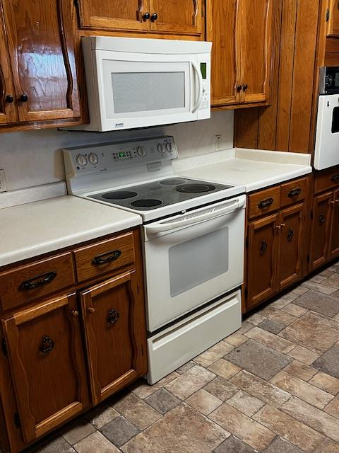 1966 Highway 142 Covington, GA 30014 - Photo 21 of 96 a stove top oven sitting inside of a kitchen