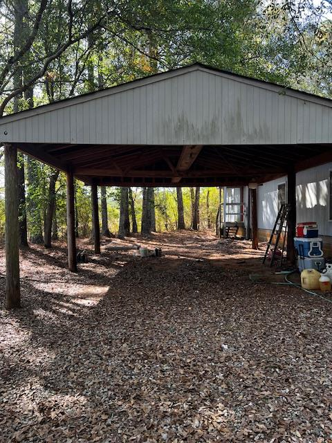 1966 Highway 142 Covington, GA 30014 - Photo 23 of 96 a view of a backyard with large trees and a sink