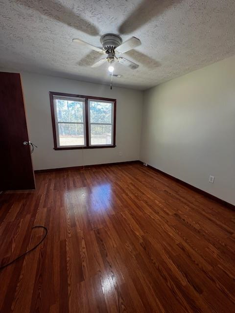 1966 Highway 142 Covington, GA 30014 - Photo 55 of 96 an empty room with wooden floor chandelier fan and windows