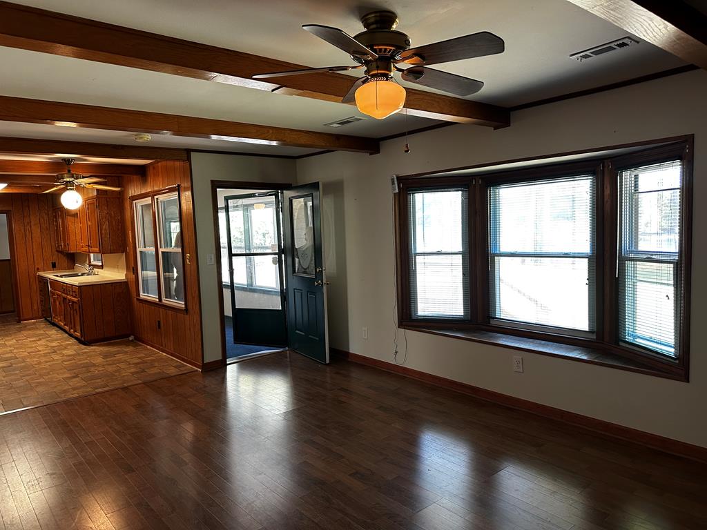 1966 Highway 142 Covington, GA 30014 - Photo 78 of 96 a view of an empty room with wooden floor and a window