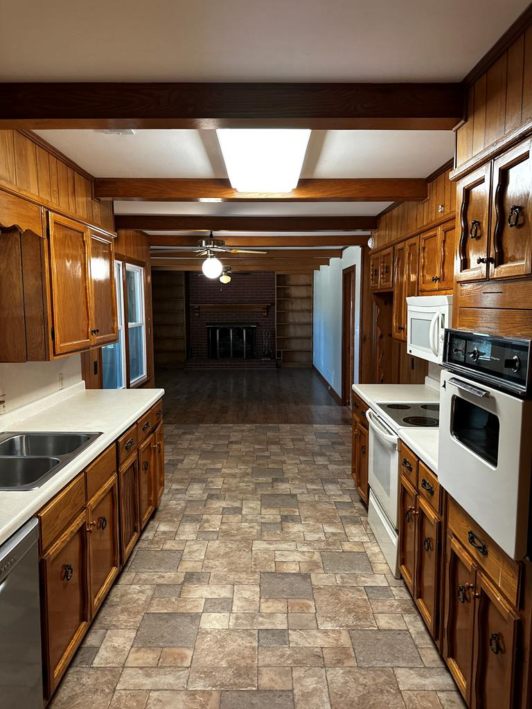 1966 Highway 142 Covington, GA 30014 - Photo 82 of 96 a kitchen with stainless steel appliances granite countertop a stove and a sink