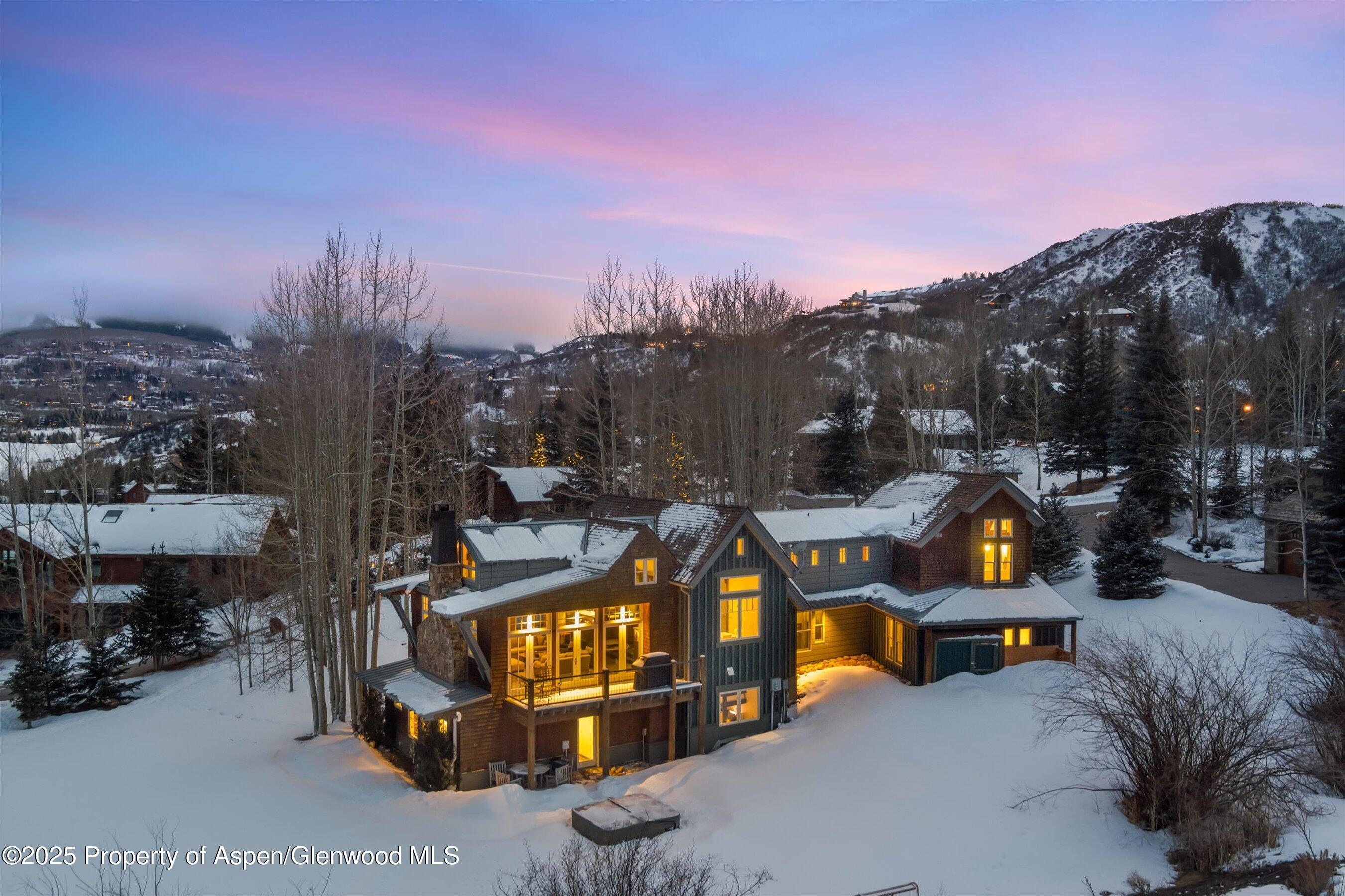 124 Trail Rider Lane Snowmass Village, CO 81615 - Photo 1 of 39 a view of a street with cars