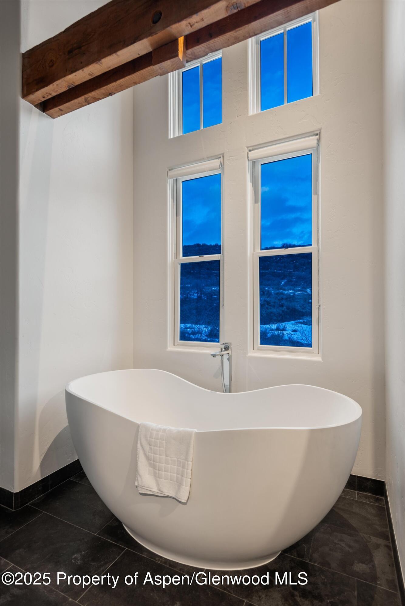 124 Trail Rider Lane Snowmass Village, CO 81615 - Photo 16 of 39 a white bath tub sitting in a bathroom