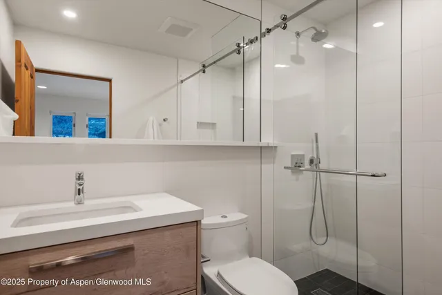 a bedroom with bed and window