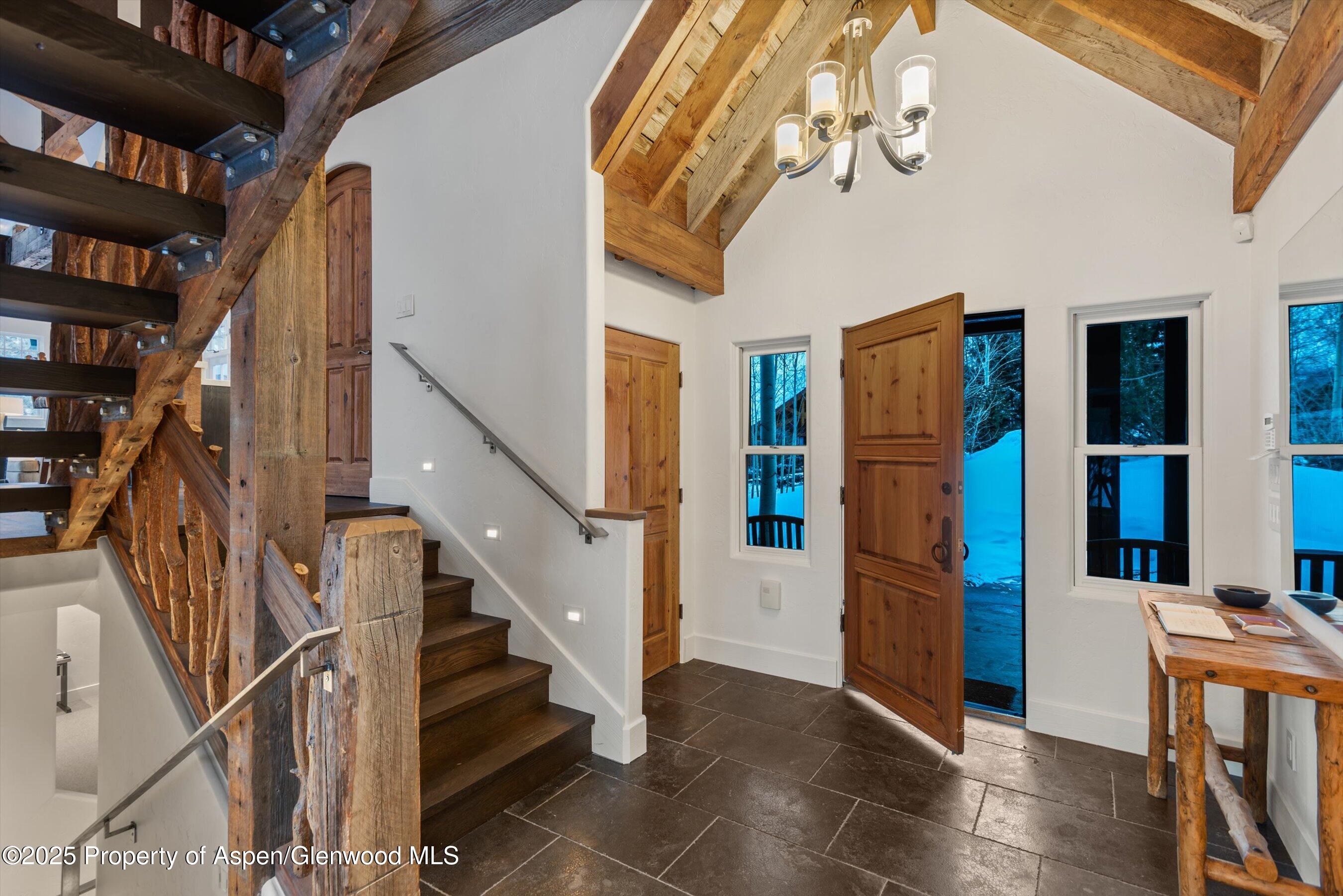 124 Trail Rider Lane Snowmass Village, CO 81615 - Photo 27 of 39 a view of entryway and hall with wooden floor