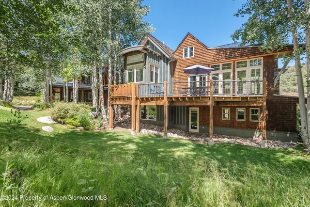 a view of houses with yard