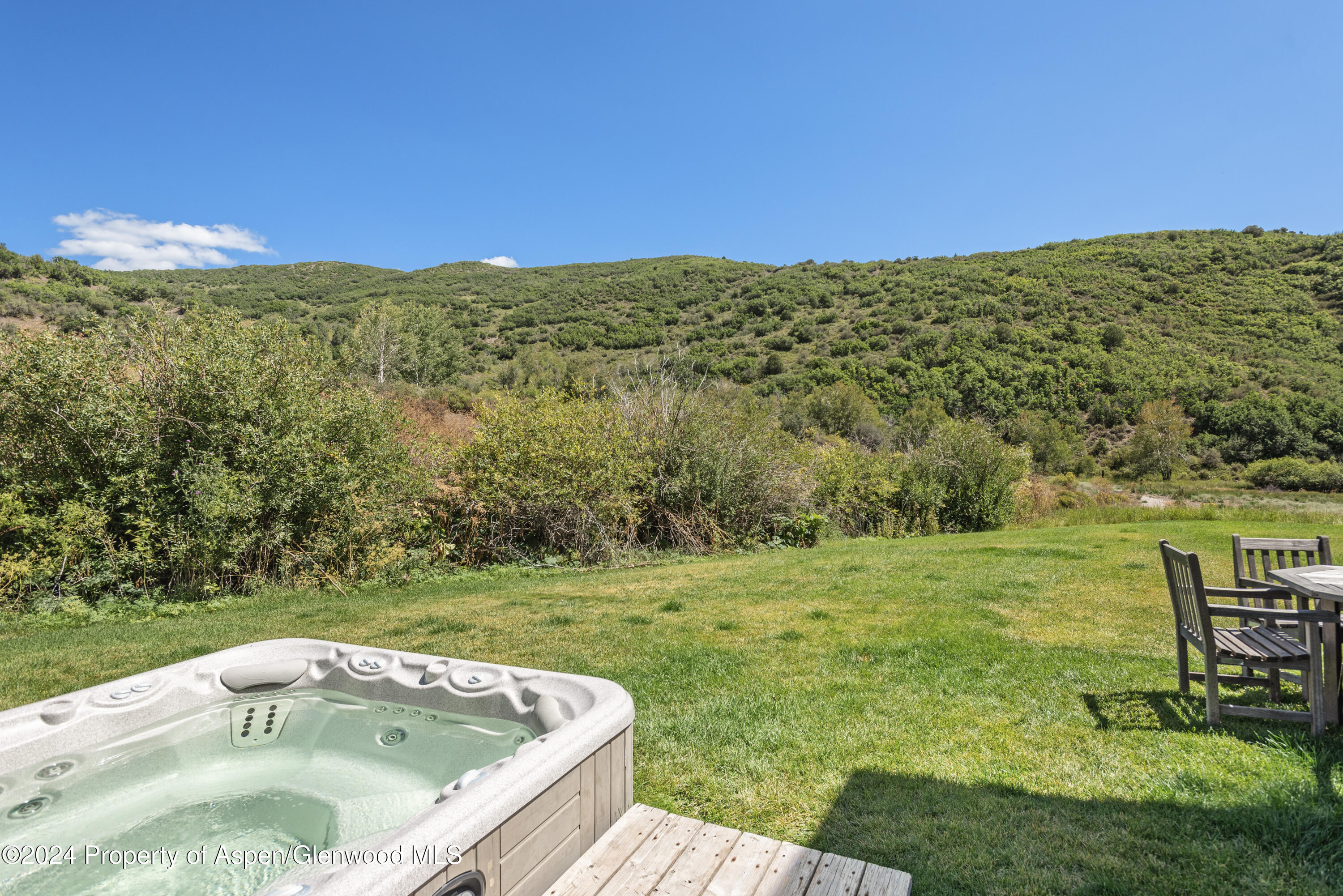 124 Trail Rider Lane Snowmass Village, CO 81615 - Photo 35 of 39 a view of a terrace with a yard