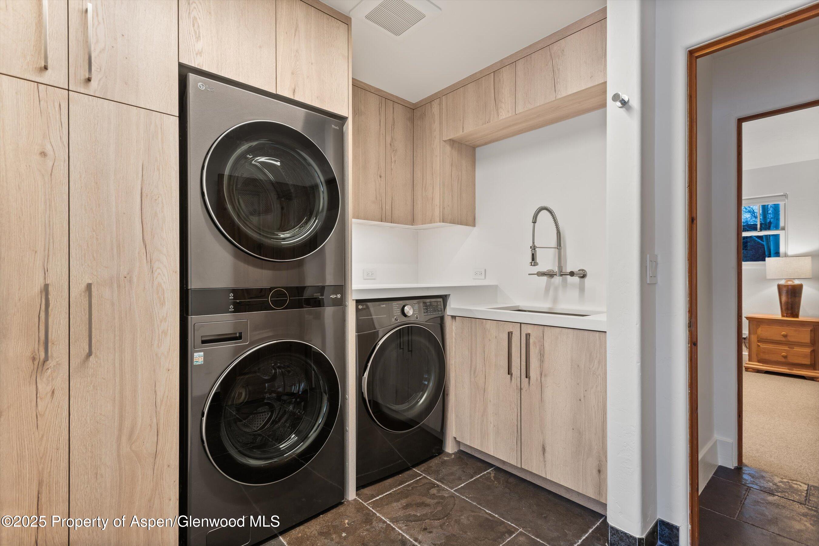 124 Trail Rider Lane Snowmass Village, CO 81615 - Photo 39 of 39 a view of a hallway with washer and dryer