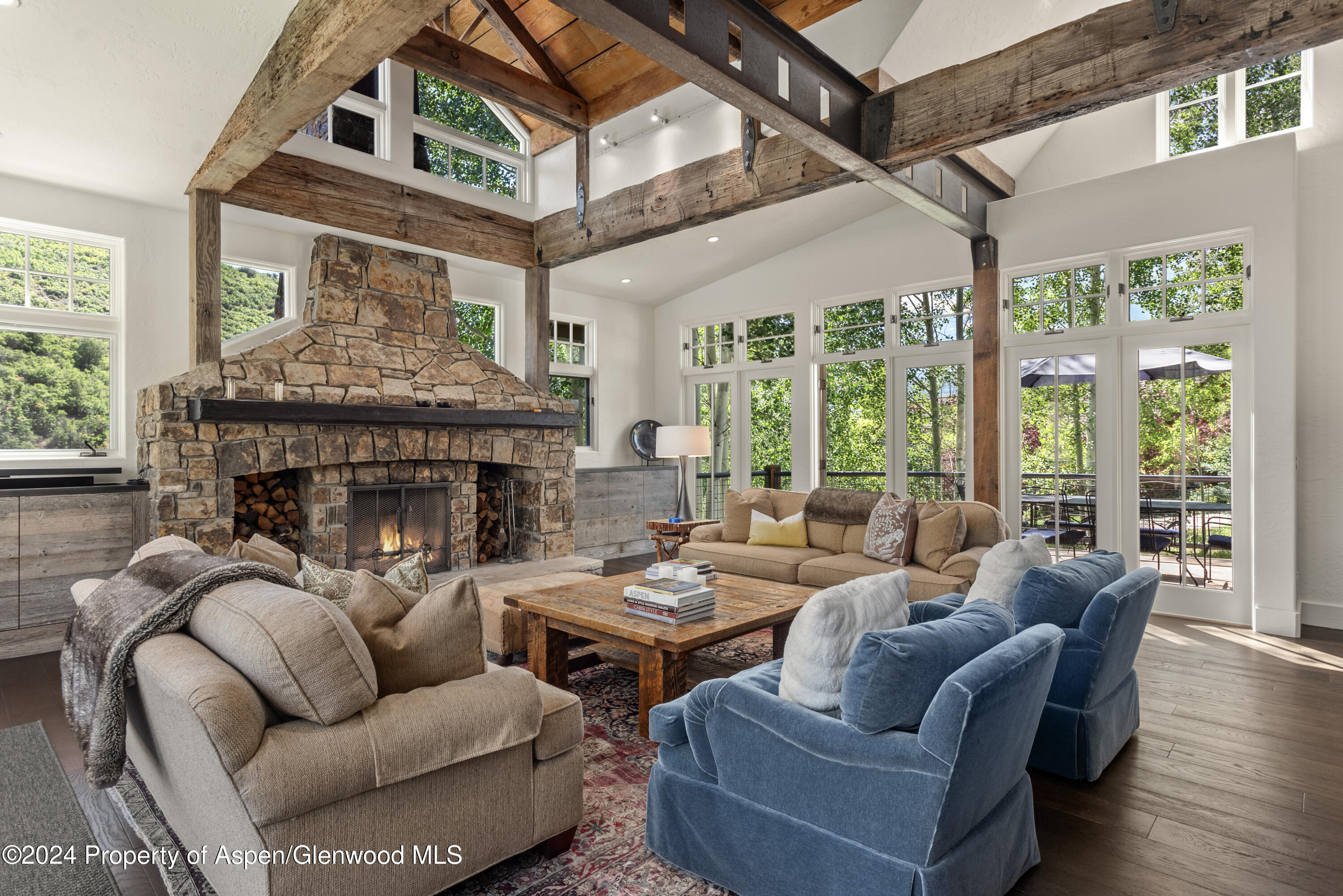 124 Trail Rider Lane Snowmass Village, CO 81615 - Photo 5 of 39 a living room with furniture and a fireplace