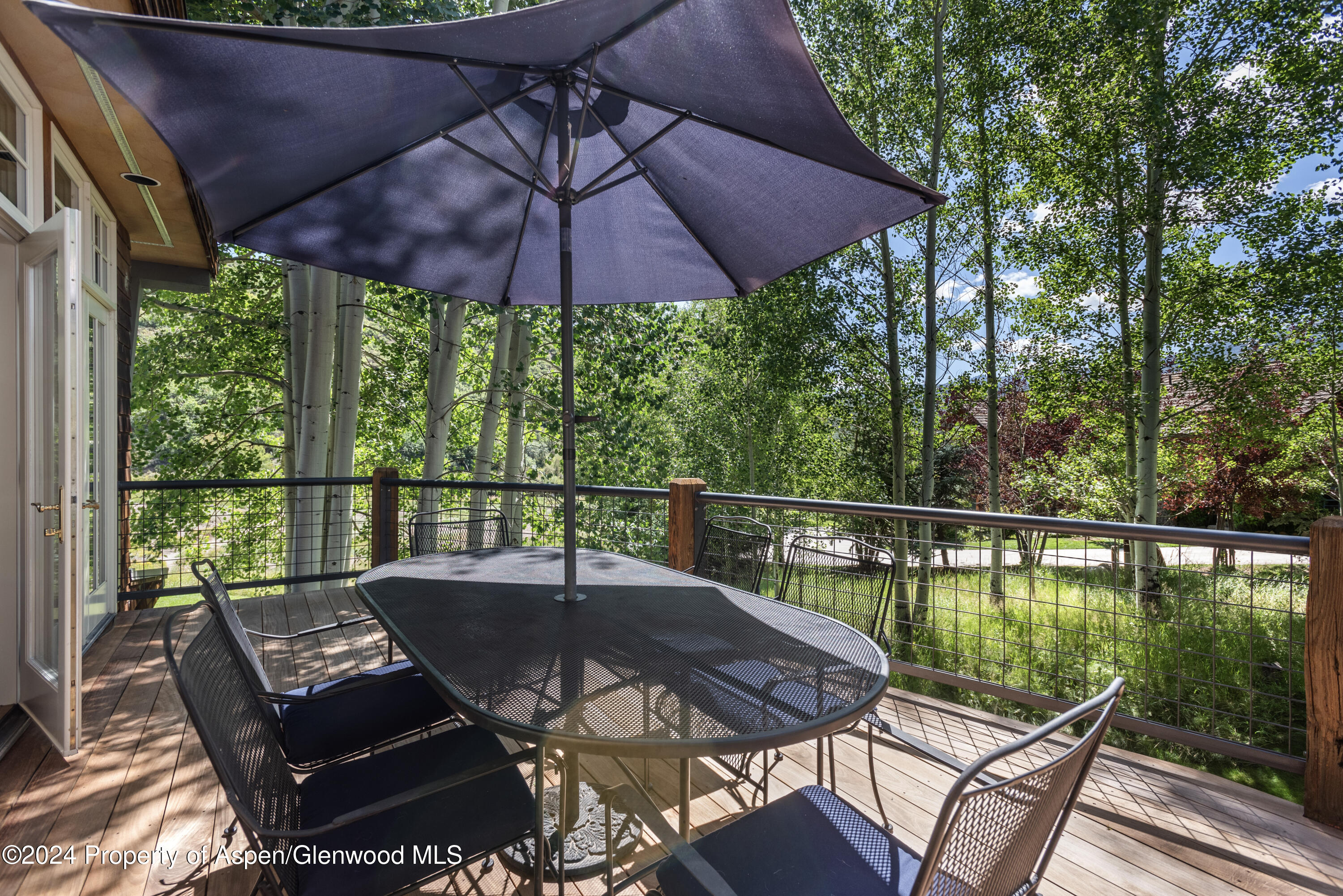 124 Trail Rider Lane Snowmass Village, CO 81615 - Photo 8 of 39 a view of balcony with furniture and umbrella