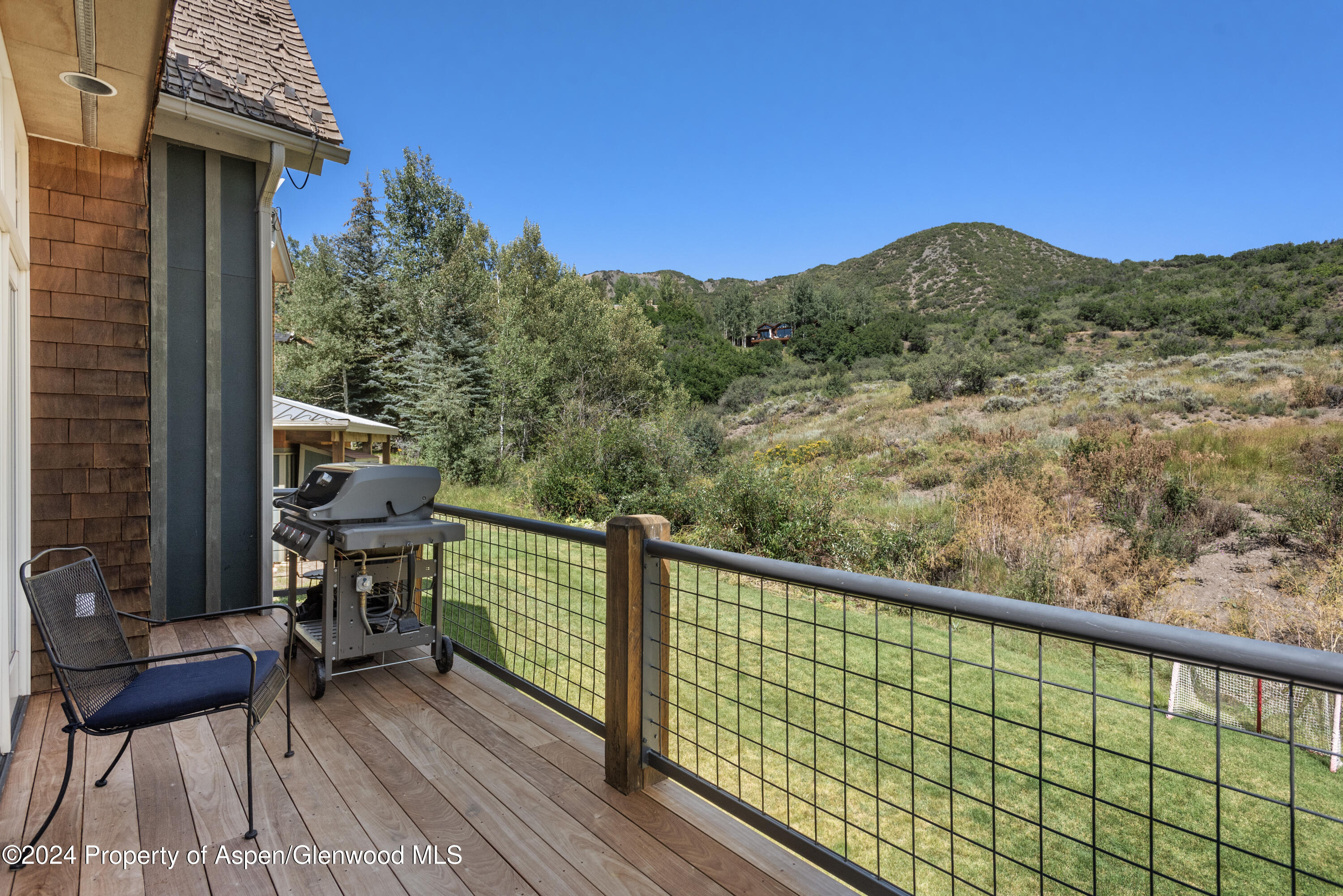 124 Trail Rider Lane Snowmass Village, CO 81615 - Photo 9 of 39 a view of balcony with furniture and wooden floor