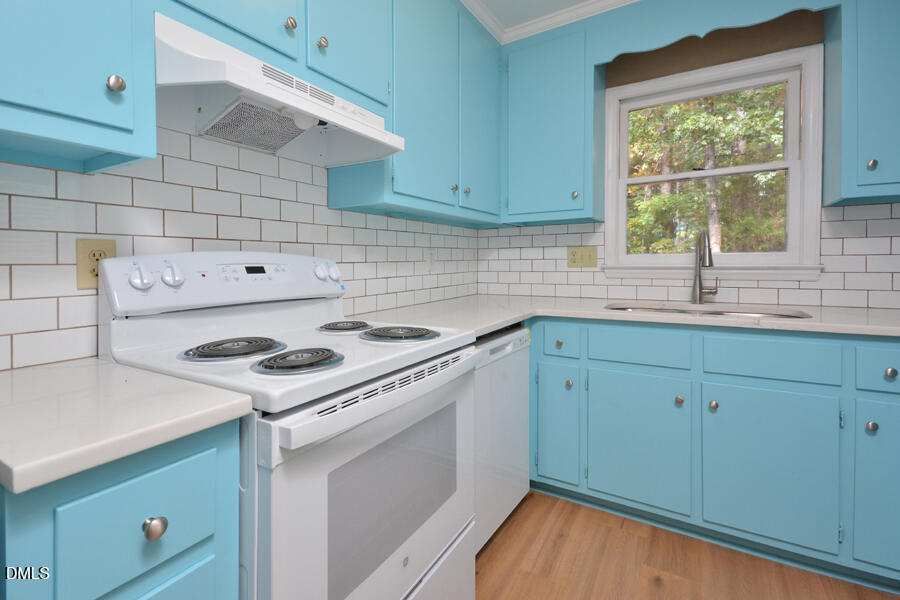 11 Tarawa Terrace, Unit B Durham, NC 27705 - Photo 11 of 32 a kitchen with a sink cabinets and a stove