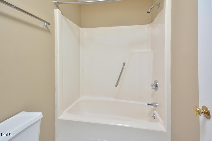 11 Tarawa Terrace, Unit B Durham, NC 27705 - Photo 21 of 32 a close up of a bathtub in a bathroom