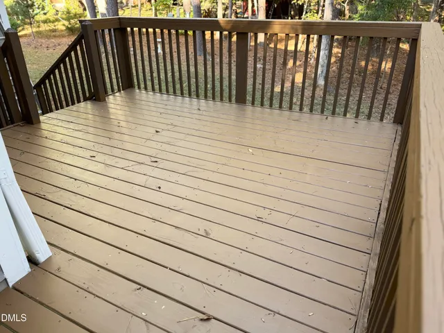 a balcony with wooden floor