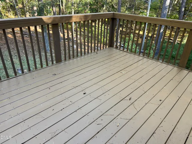 a view of balcony with wooden floor