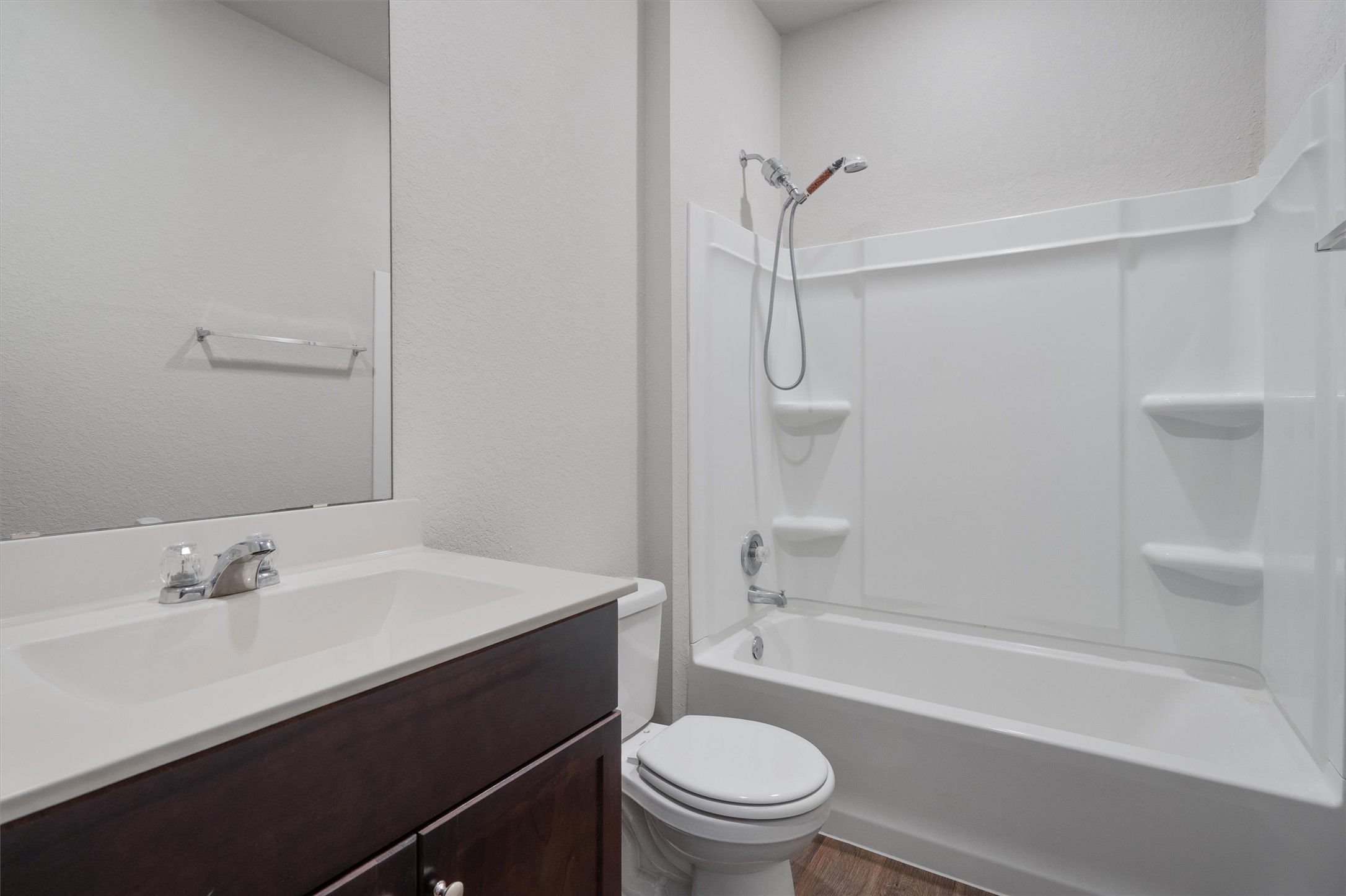 6121 Ronee Leah Drive Austin, TX 78724 - Photo 27 of 30 A well-appointed bathroom with a vanity and a shower-over-tub combination.