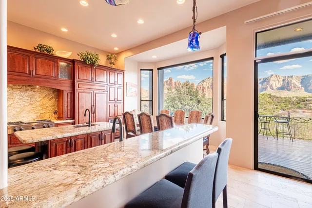 a bathroom with a sink a vanity and a painting on the wall