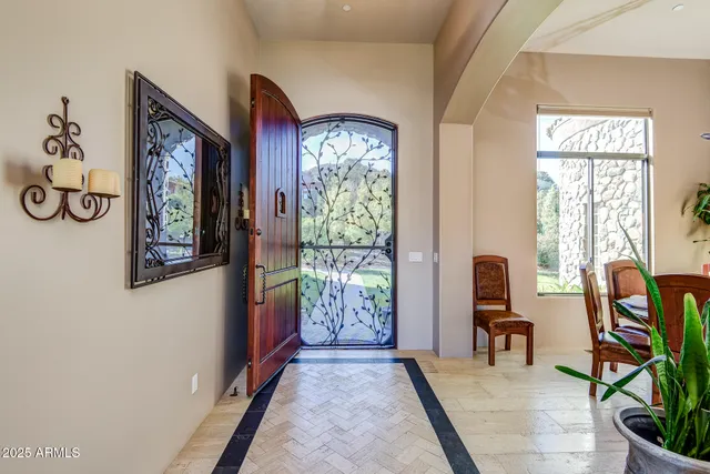 a bathroom with a granite countertop sink a mirror and a shower