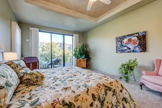 a bed room with a bed and a chandelier
