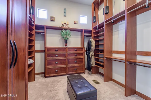 a bedroom with a bed and a potted plant