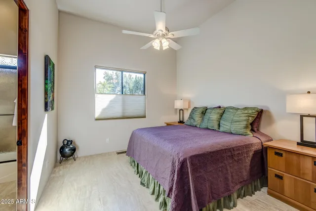 a view of a patio with table and chairs with wooden floor and fence