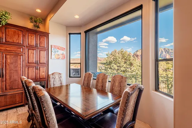 a view of a dining room with furniture window and outside view