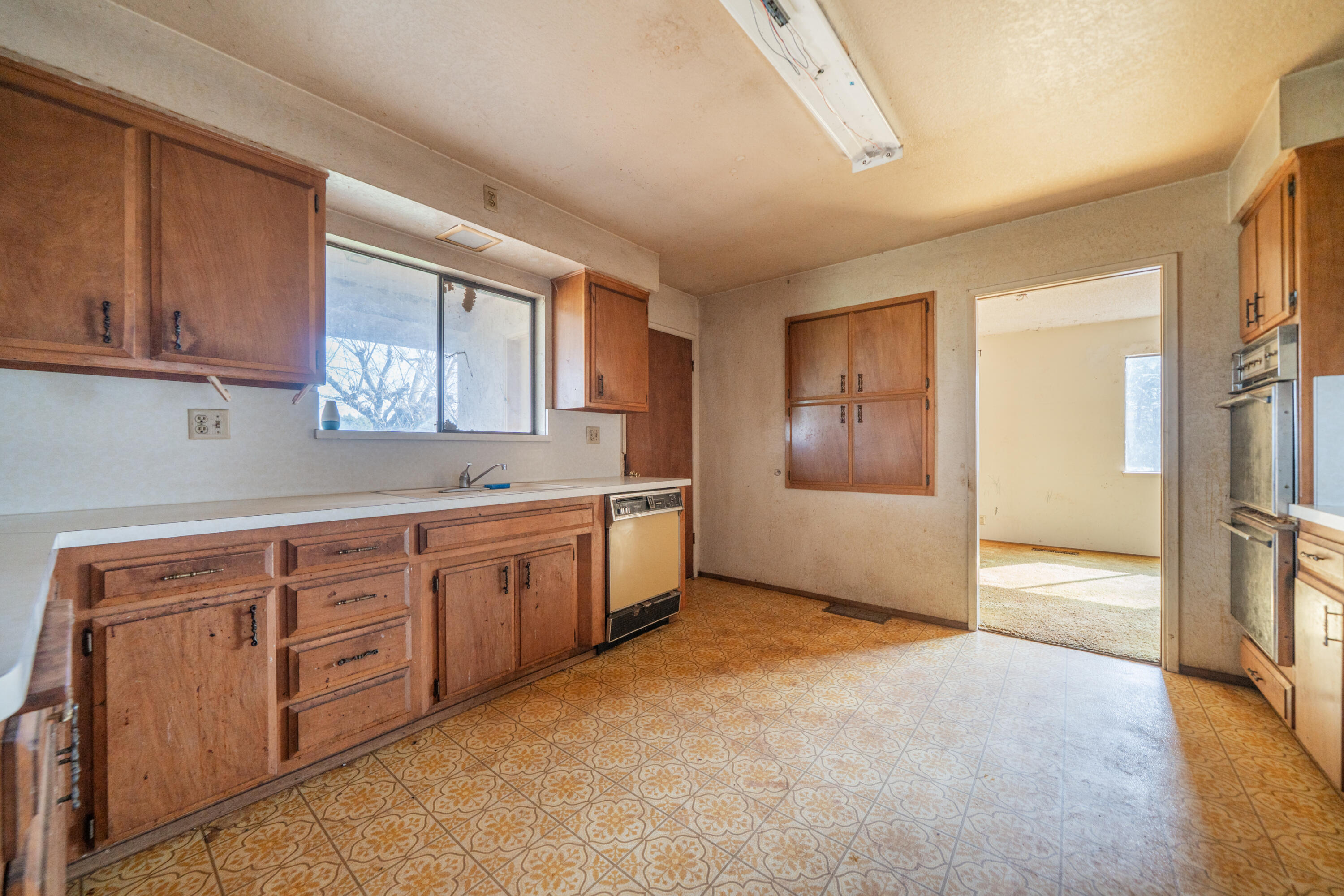 8743 Airport Road Redding, CA 96002 - Photo 9 of 39 KITCHEN TOWARD LIVING ROOM ROOM