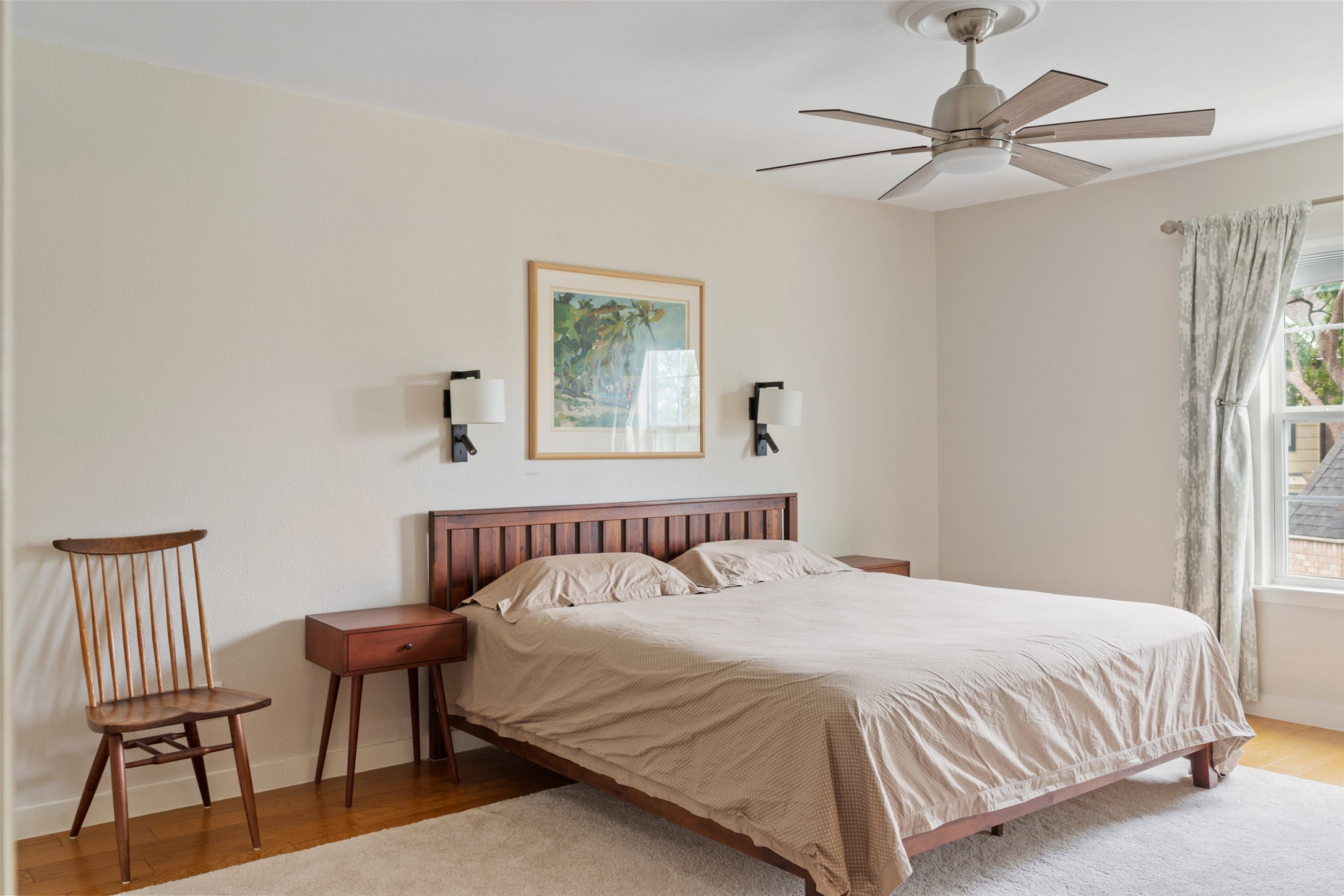 3467 North Hills Drive Austin, TX 78731 - Photo 24 of 40 a bedroom with a bed and a chair
