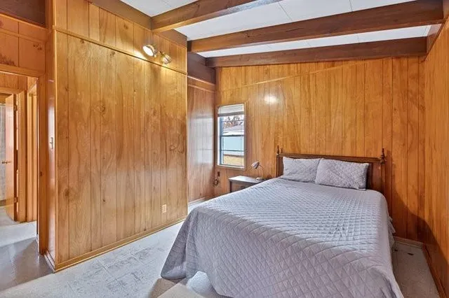 a bedroom with a bed and a shower