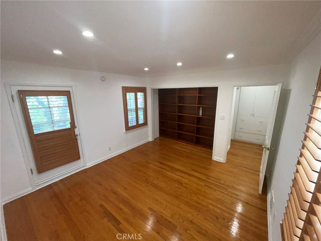 135 Canon Drive Beverly Hills, CA 90212 - Photo 20 of 42 a view of an empty room with a fireplace