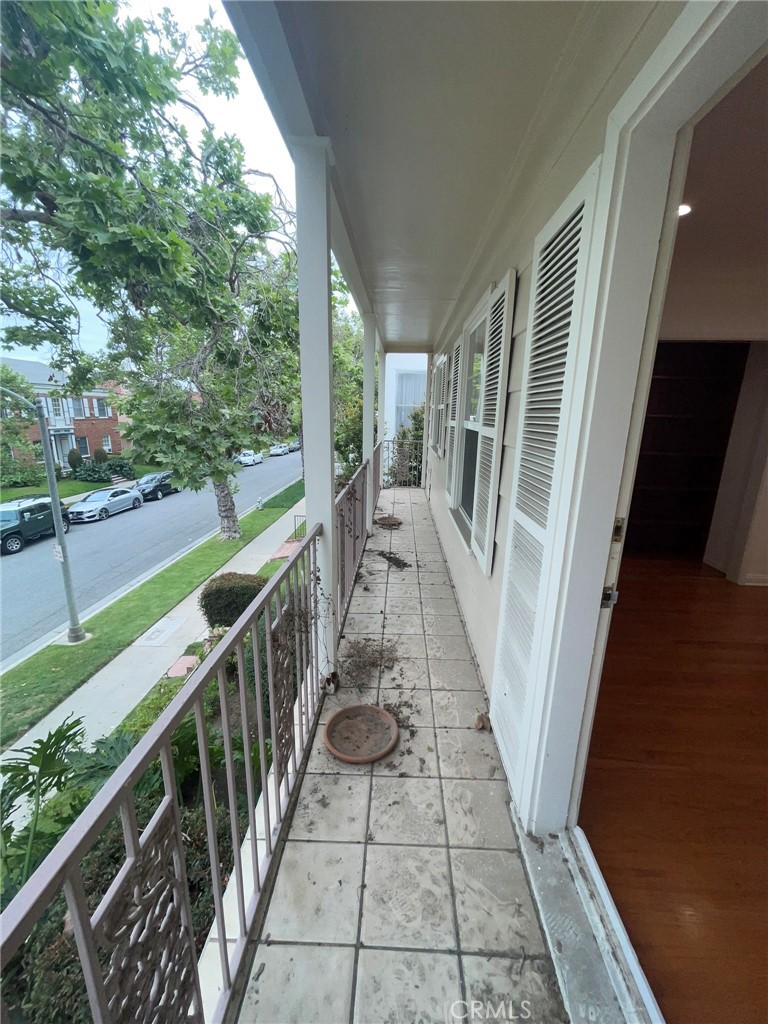 135 Canon Drive Beverly Hills, CA 90212 - Photo 25 of 42 a view of balcony with wooden floor