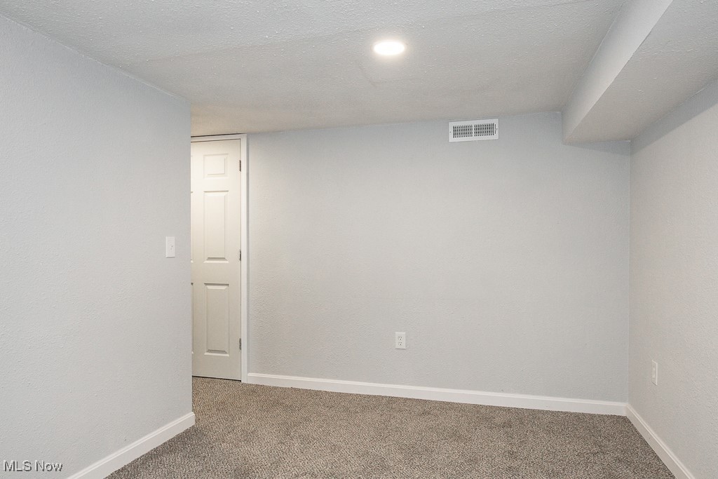 5607 Ridgewood Avenue Parma, OH 44129 - Photo 20 of 23 Carpeted empty room with a textured ceiling
