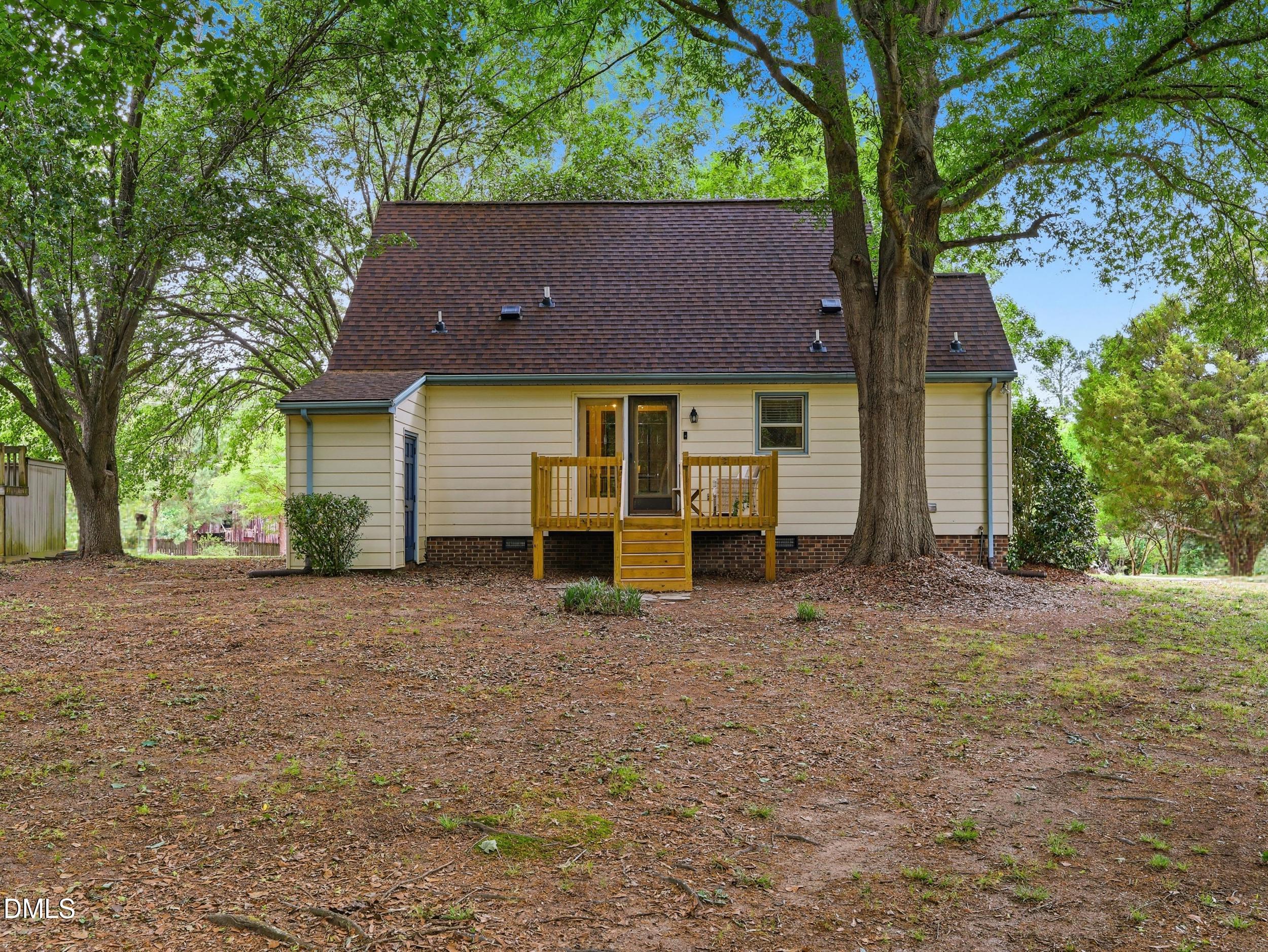 517 Lake Glad Road Wendell, NC 27591 - Photo 26 of 36 a view of a house with a yard and large tree