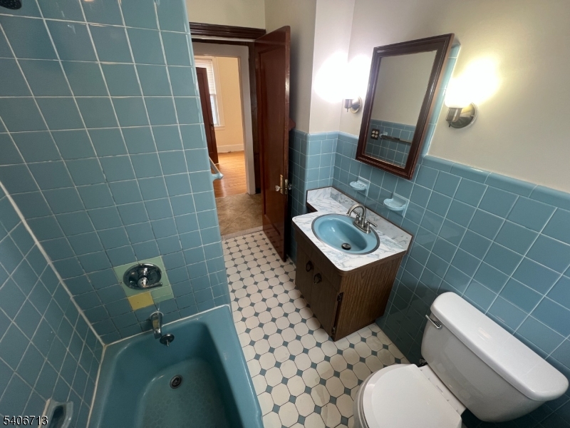 1044 Cross Avenue Elizabeth, NJ 07208 - Photo 8 of 9 a bathroom with a sink toilet and mirror